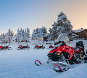 Snowmobiles by the main building 