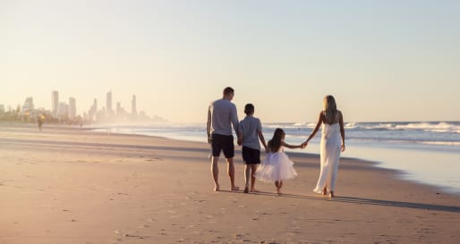 Family walking on Bondi Beach