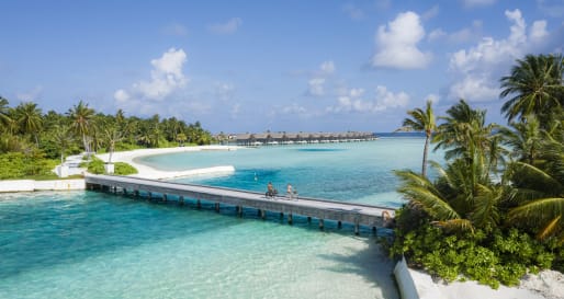Bridge with couple cycling  