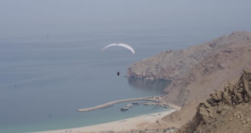 Paragliding into Zighy Bay