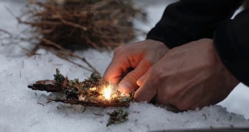 Fire lighting - Winter survival skills at Ice Hotel