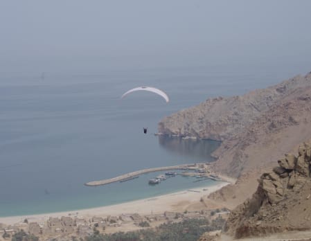 Paragliding into Zighy Bay