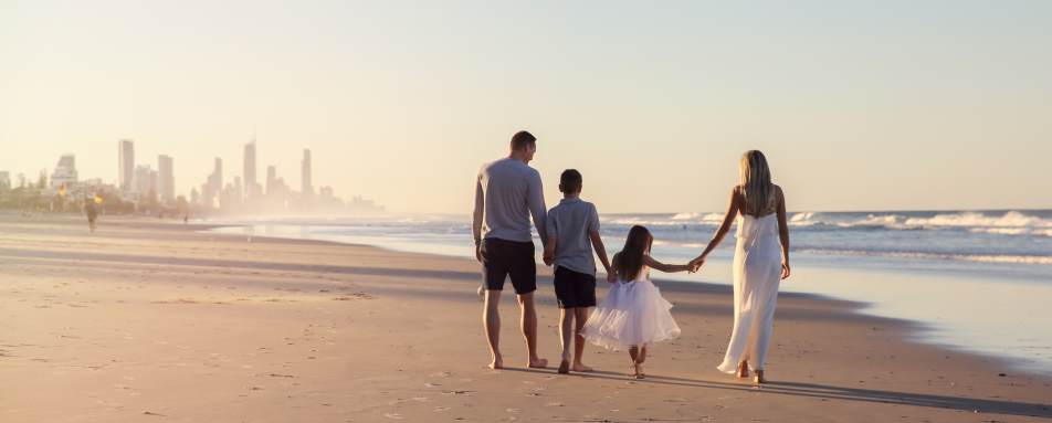 Family walking on Bondi Beach  
