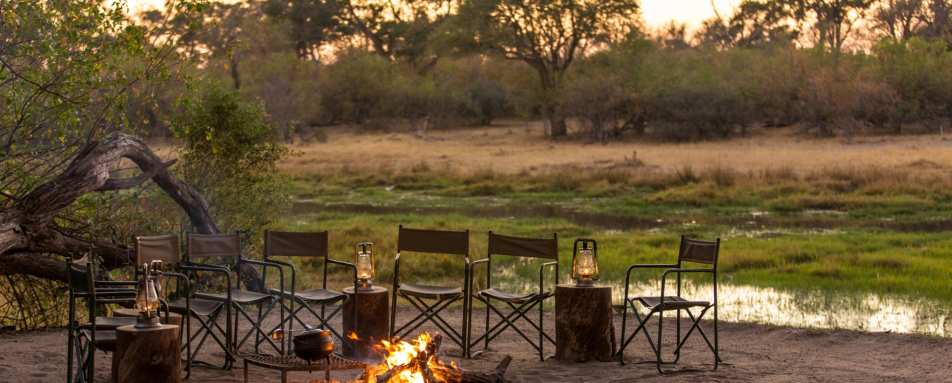 Camp fire, river - Machaba Camp