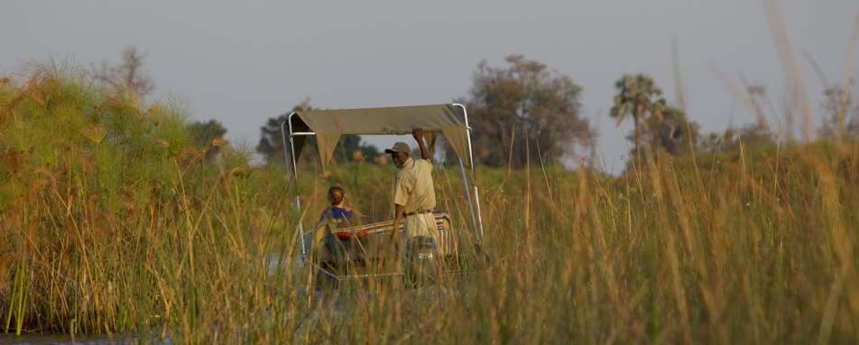 Boating along channels - Botswana Honeymoon