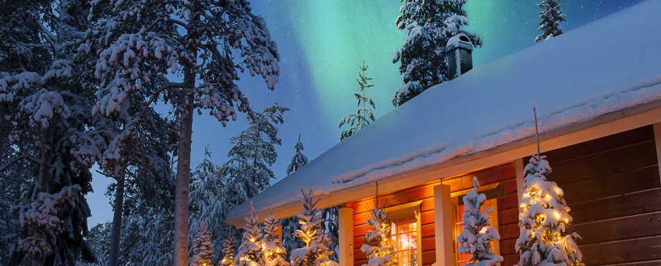 Exterior with Northern Lights - Rovaniemi Christmas Chalets