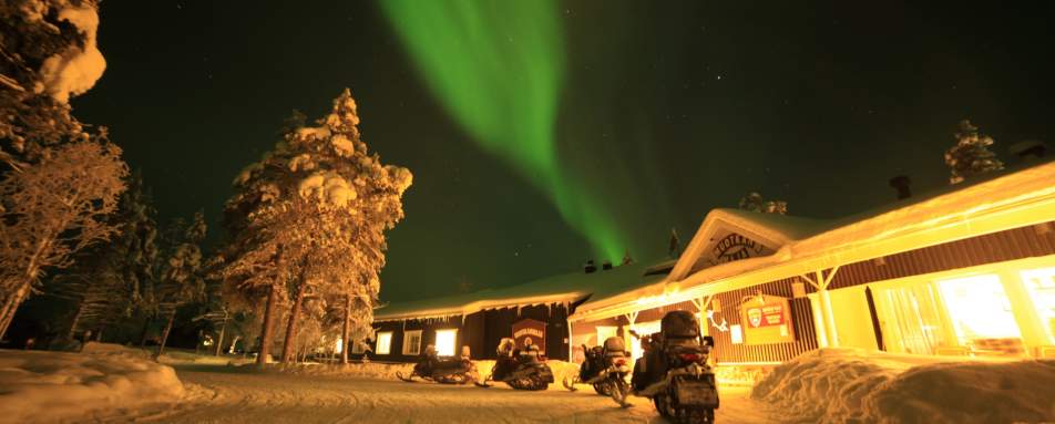 Snowmobiles outside main building 