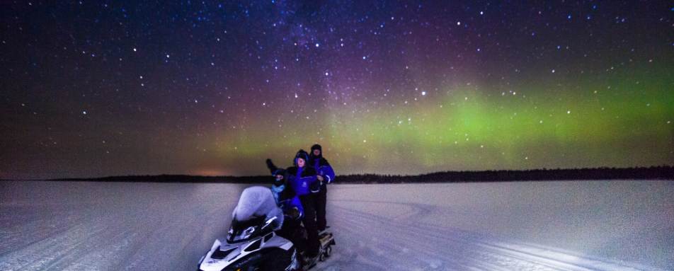 Snowmobile with Northern Lights