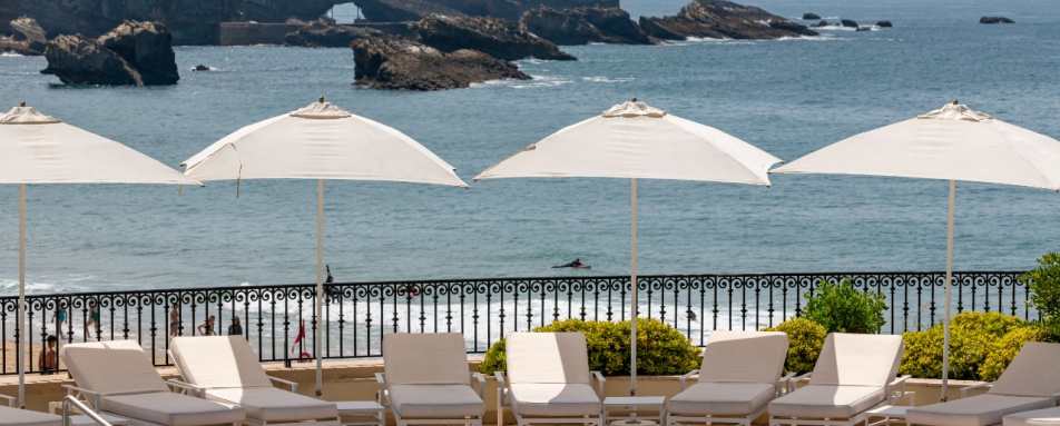 Sunlounges by the swimming pool 