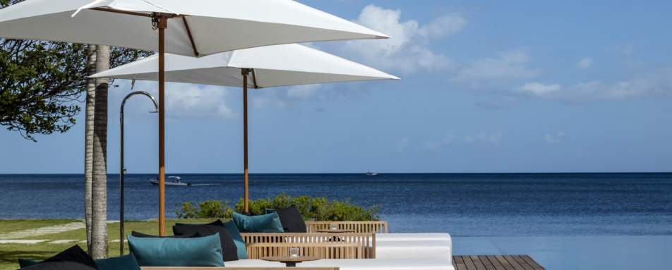 Beachfront Villa chaise longues on the deck