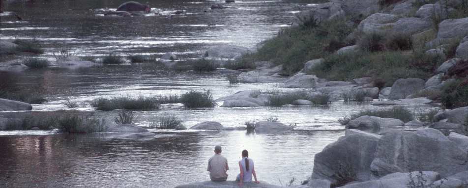 Honeymooners enjoy a sundowner - Rekero Camp