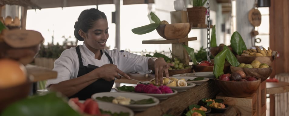 Longitude - breakfast chef cutting fruit  