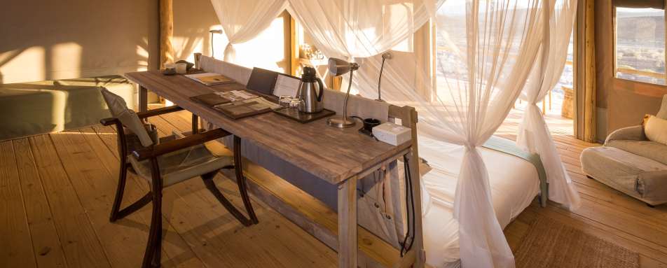 Writing desk at back of room 