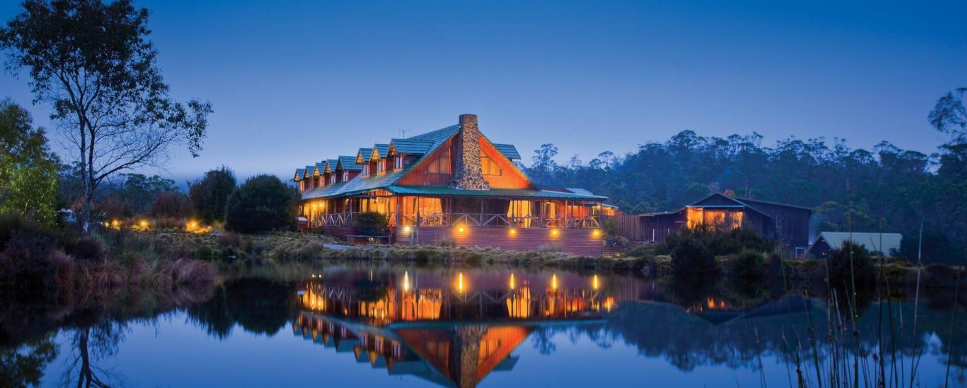 Exterior by night - Cradle Mountain Lodge