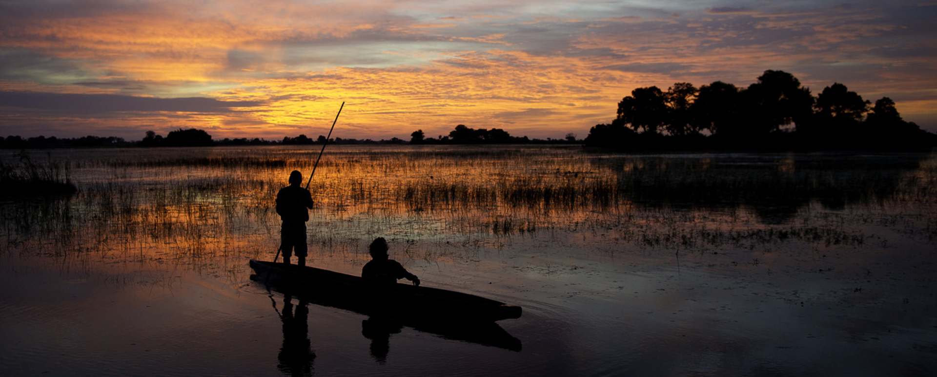 Sunset from a mokoro - Tubu Tree Camp