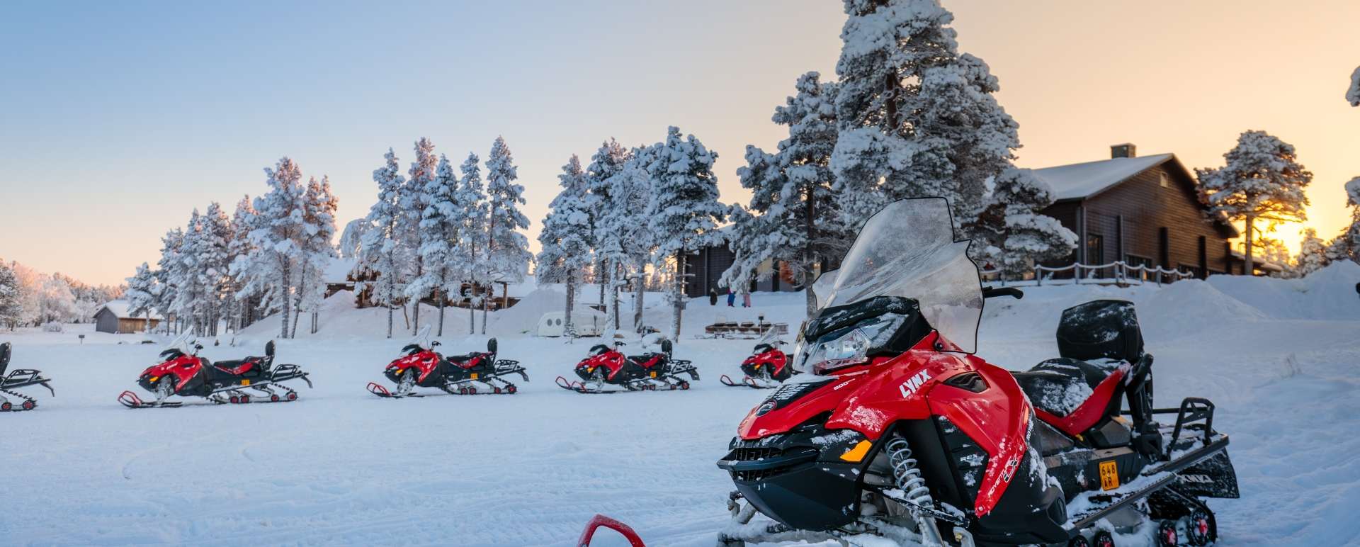 Snowmobiles by the main building 