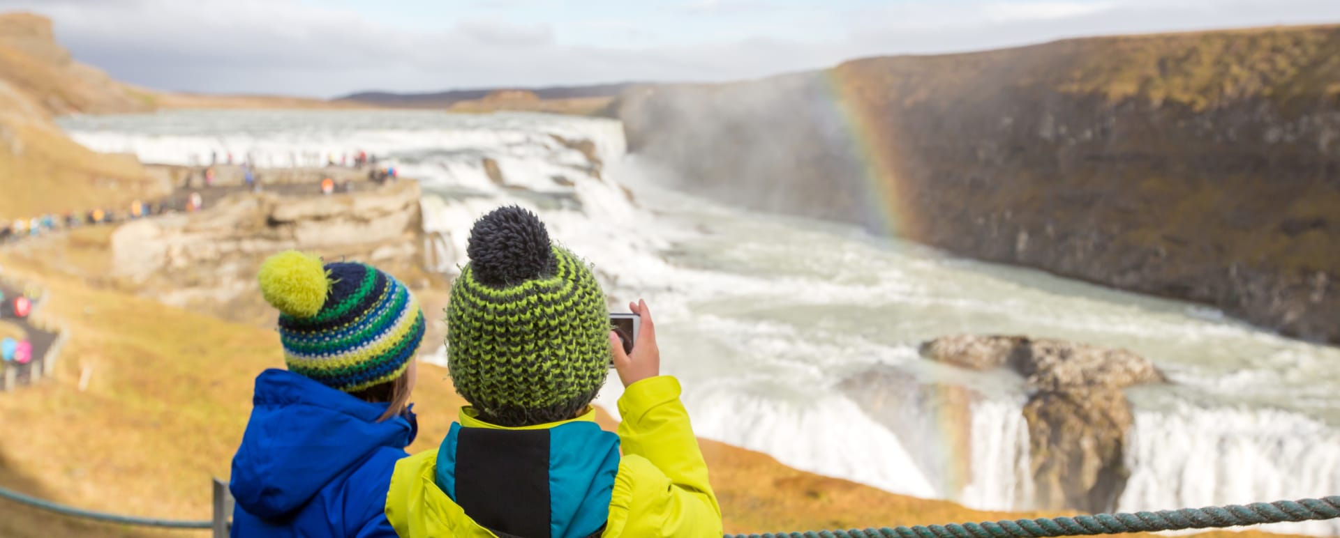 Children taking a photo of hte waterfalls 
