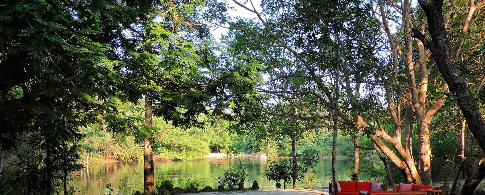 Sofa beside the water - Shergarh Tented Camp