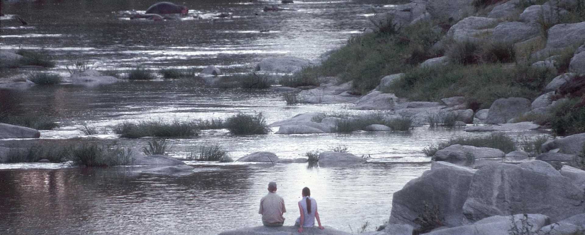 Honeymooners enjoy a sundowner - Rekero Camp