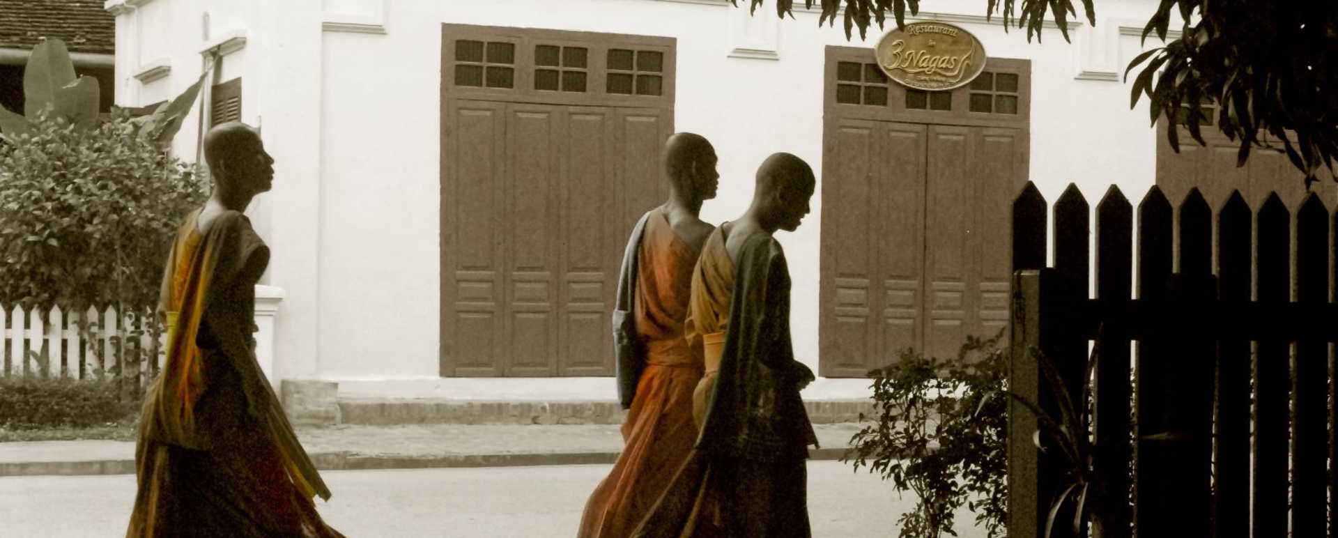 Monks passing by the hotel - 3 Nagas by Alila