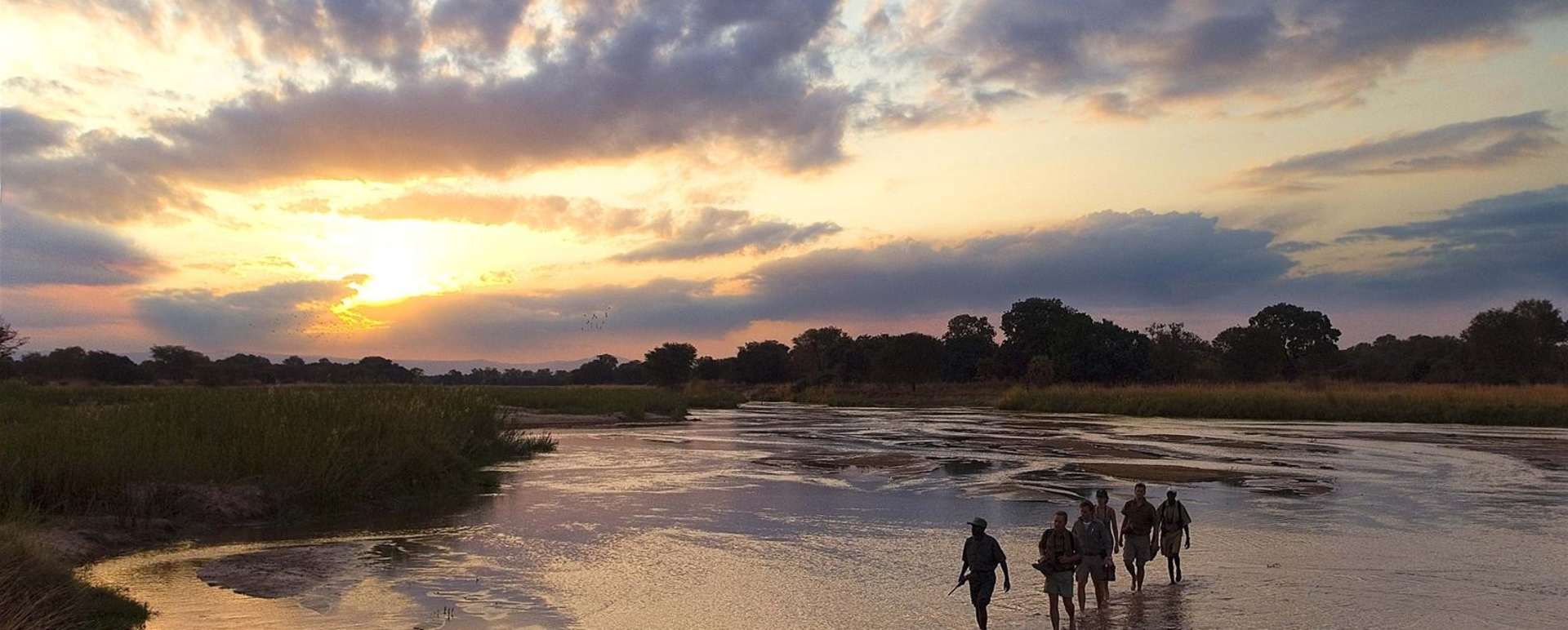 Walking across the Mupamadzi River - Walk Zambia