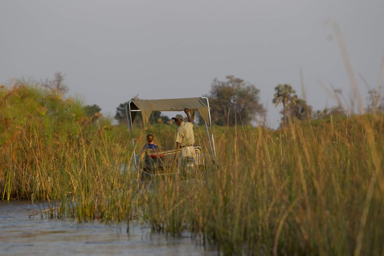 Boating along channels - Botswana Honeymoon