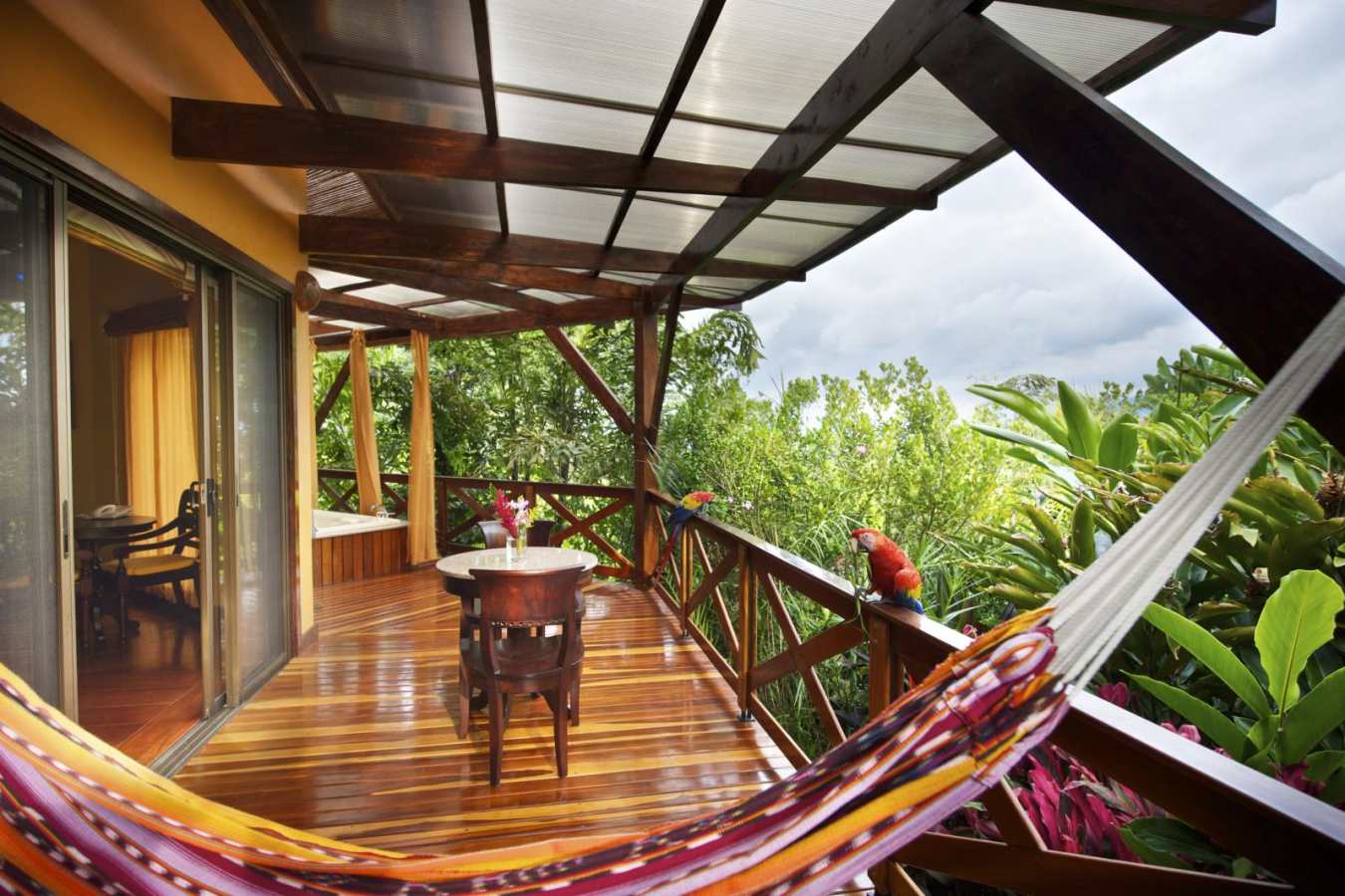 Rainforest Villa balcony with parrots