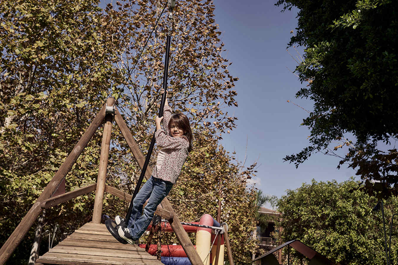 Child on zip-line in playground