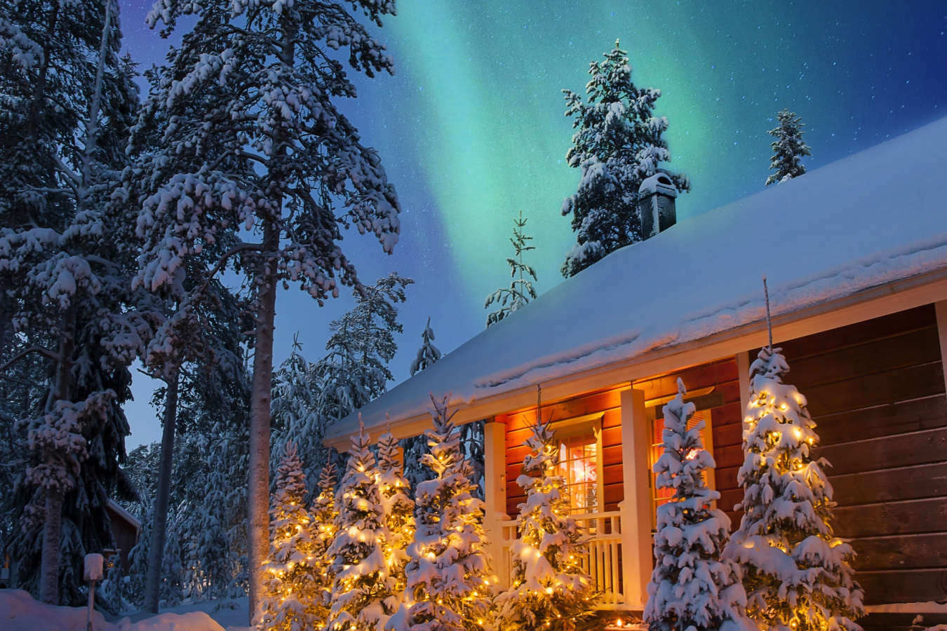 Exterior with Northern Lights - Rovaniemi Christmas Chalets