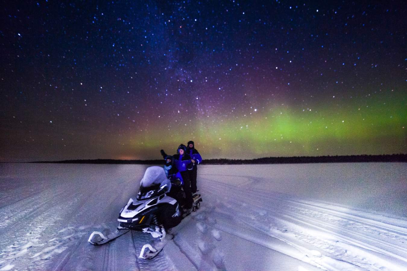 Snowmobile with Northern Lights