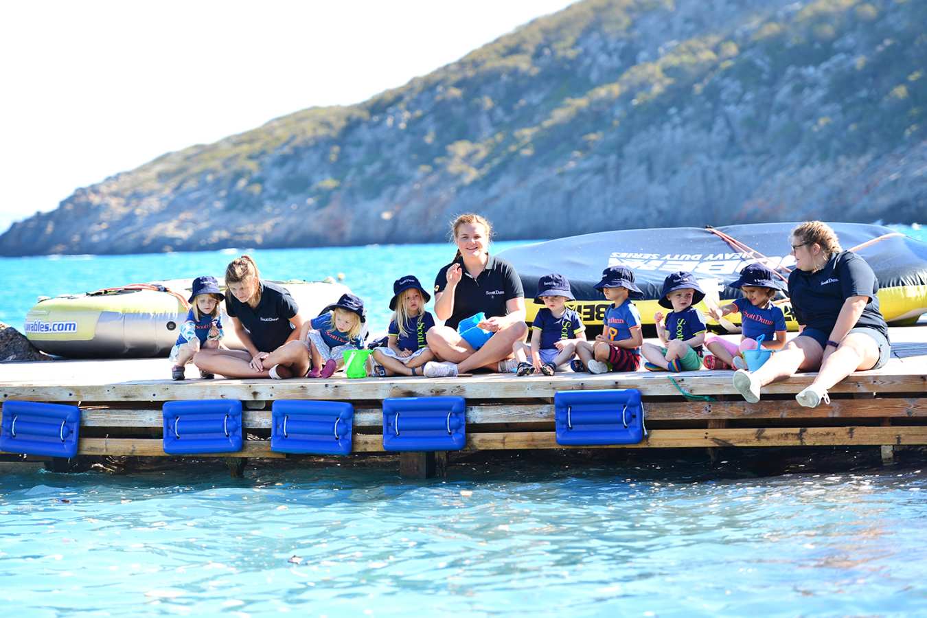 Children on a dock for Explorers Kids Club 