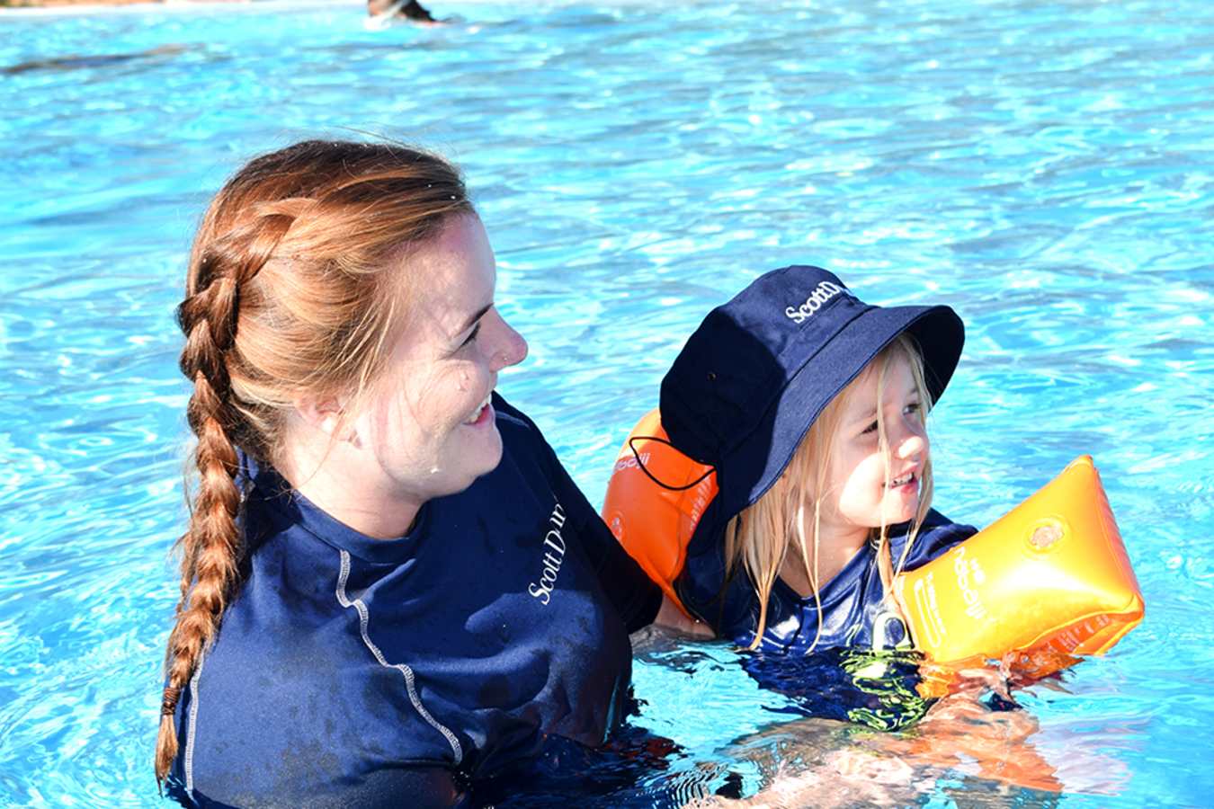 Child in pool with SDE employee 