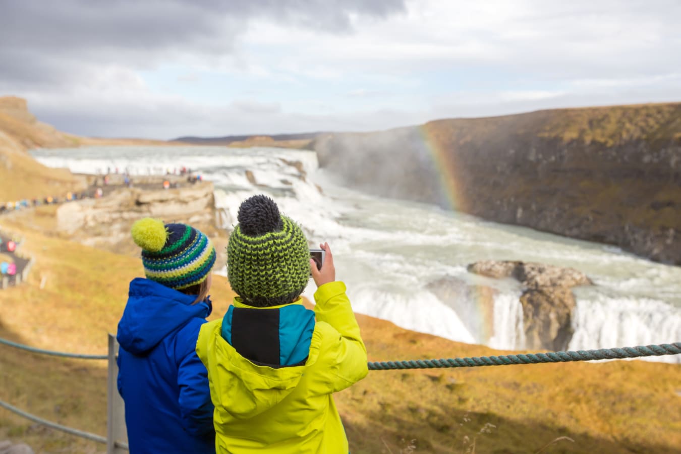 Children taking a photo of hte waterfalls 