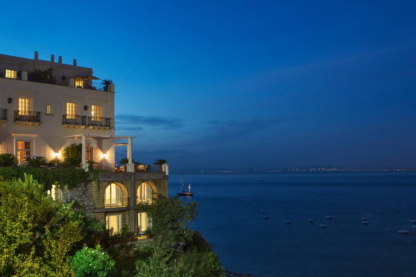 Exterior at night - JK Place Capri