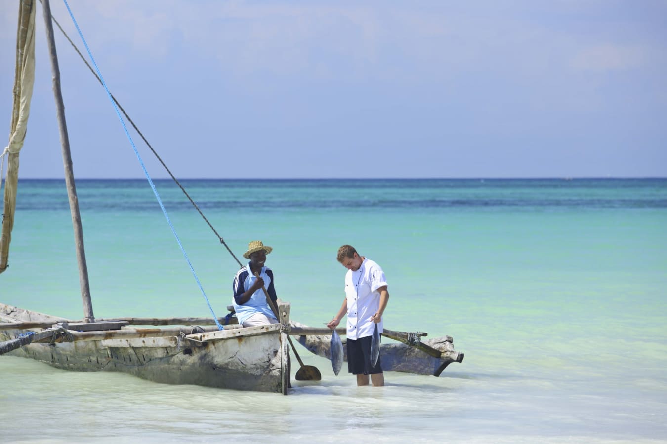 Chef and fisherman on beach
