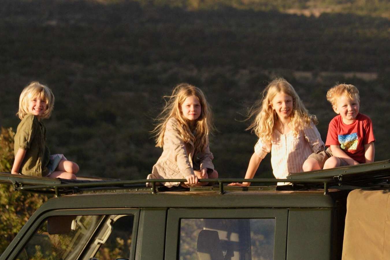 Kids on vehicle - Safari and beach for families in Kenya