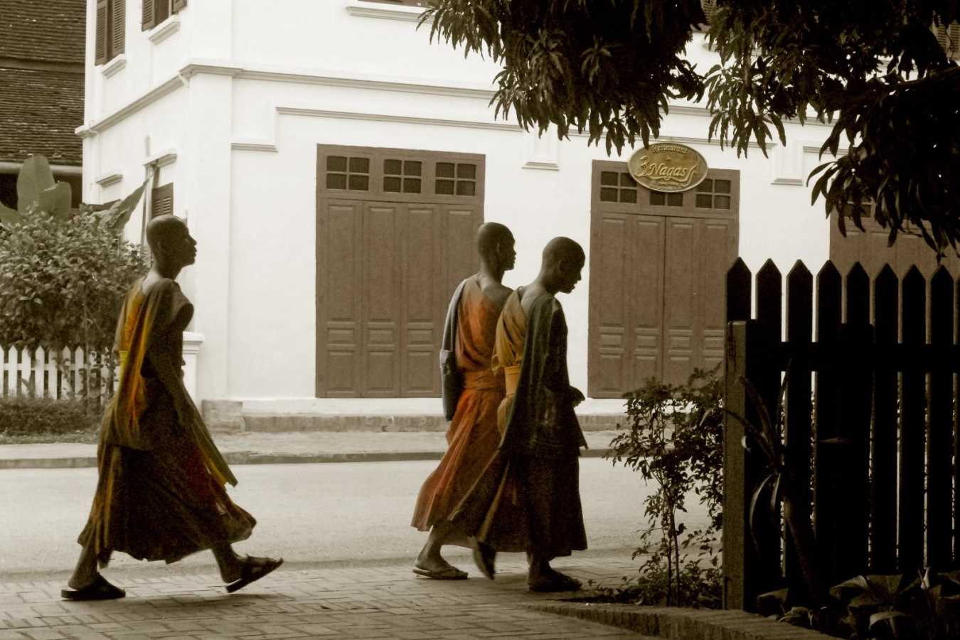 Monks passing by the hotel - 3 Nagas by Alila