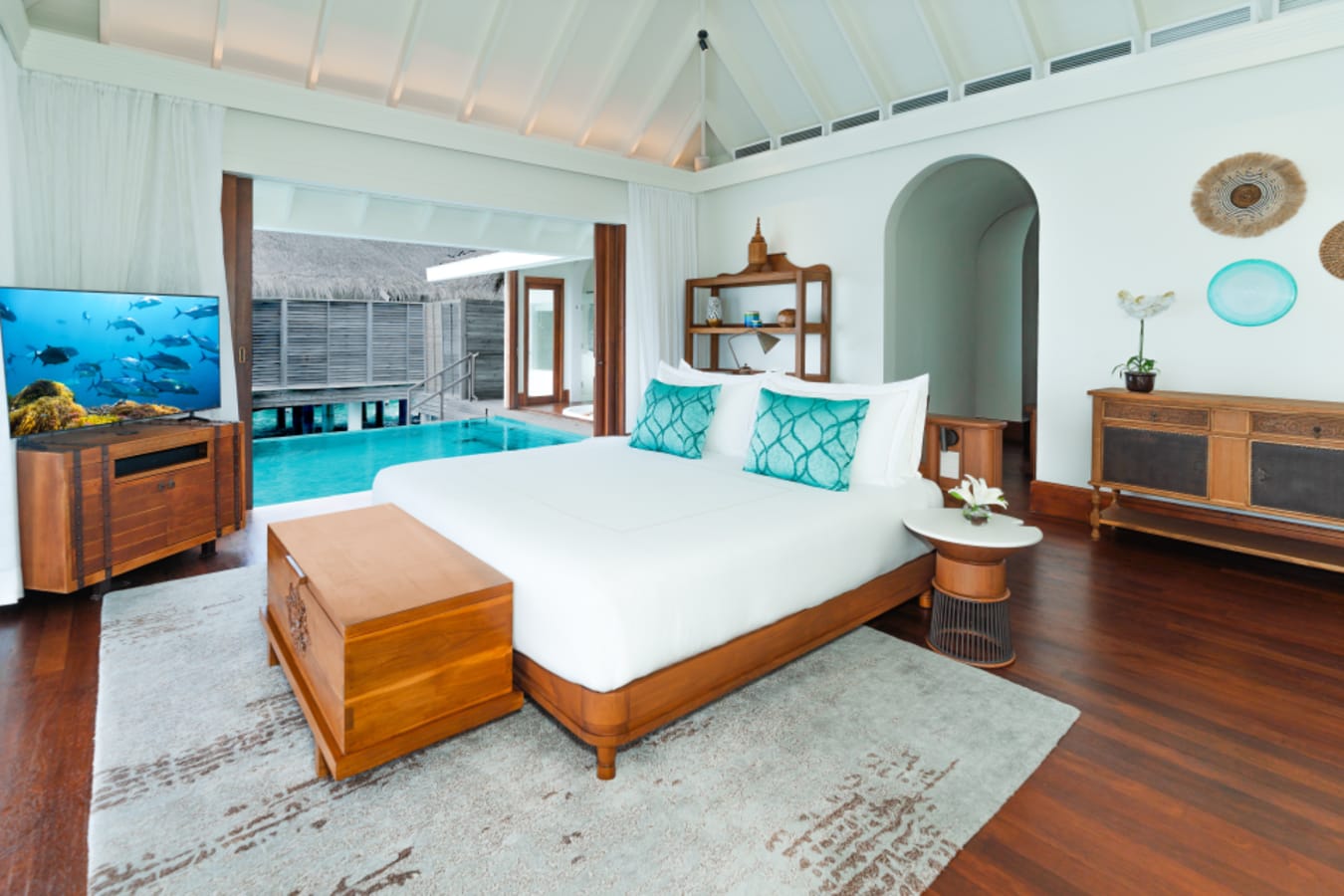 Over Water Pool Villa Bedroom and Pool
