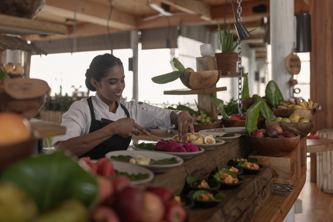 Longitude - breakfast chef cutting fruit  