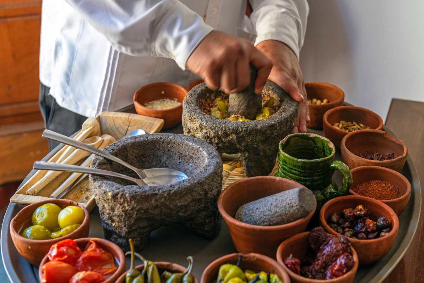 Chef preparing a traditional Pasilla Chili Sauce