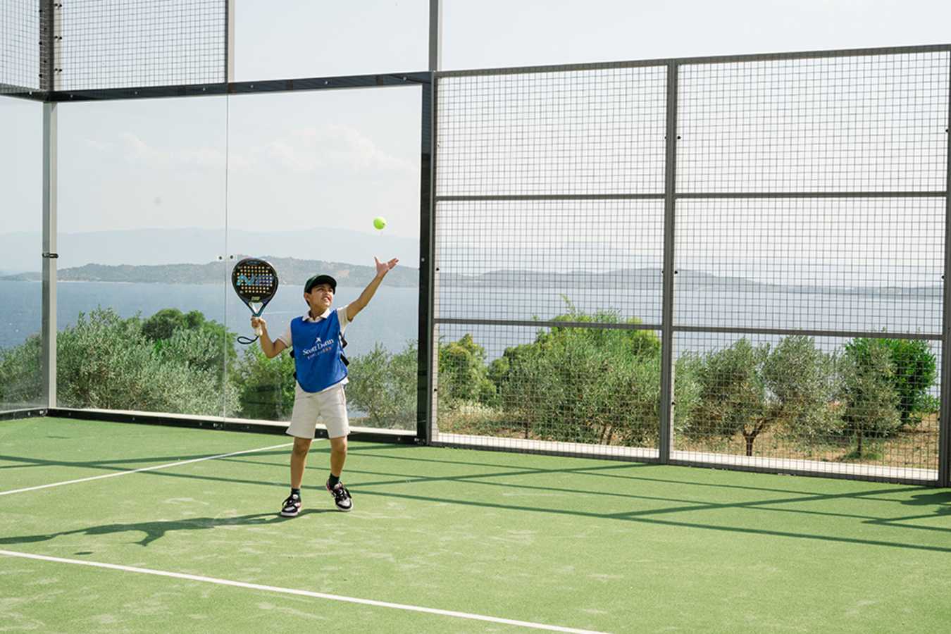 Child playing tennis
