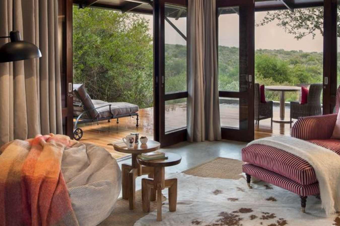 The lounge in a red suite - Kwandwe Ecca Lodge