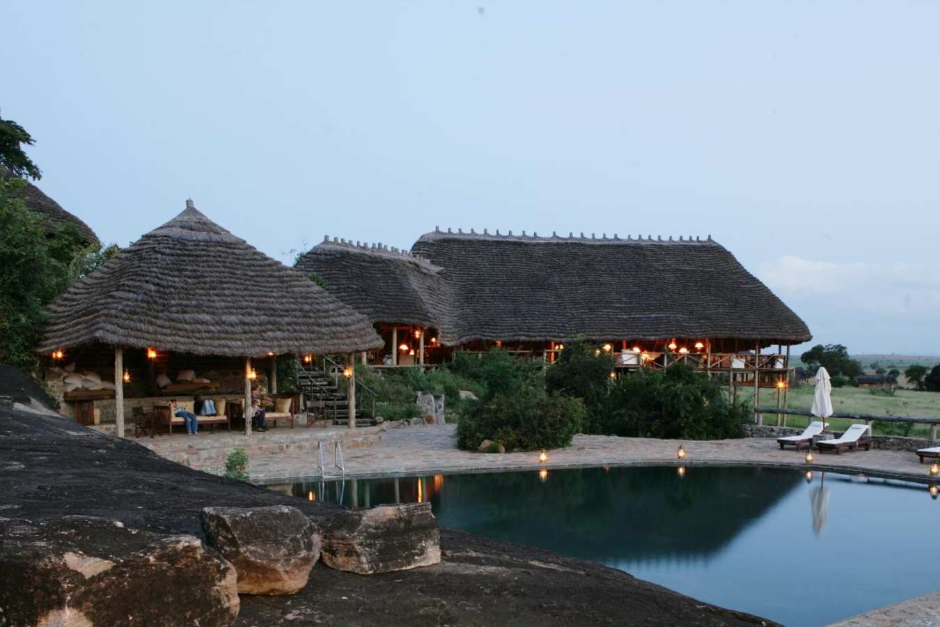 Lodge and pool at dusk - Apoka Lodge
