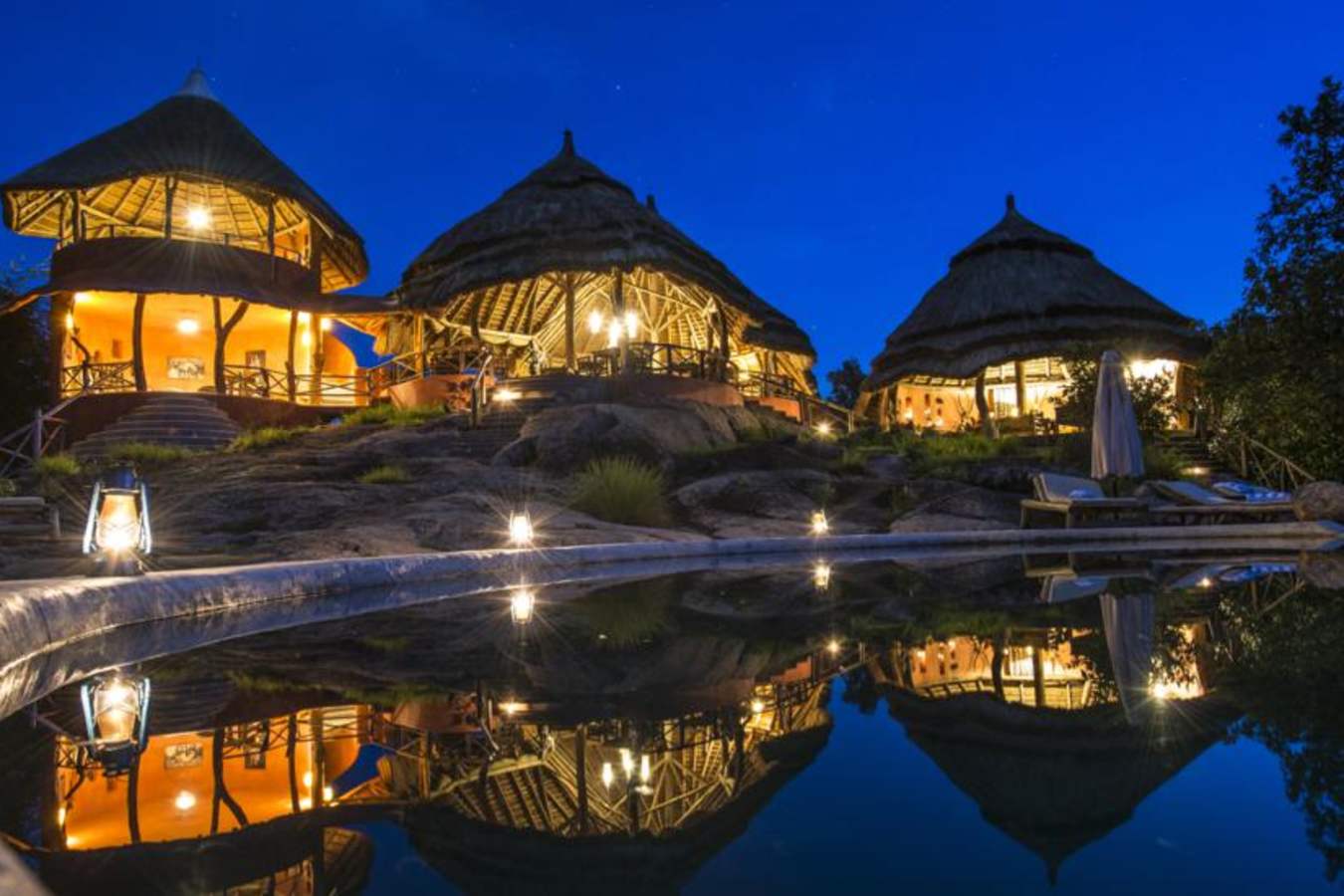 Lodge and pool by night - Mihingo Lodge
