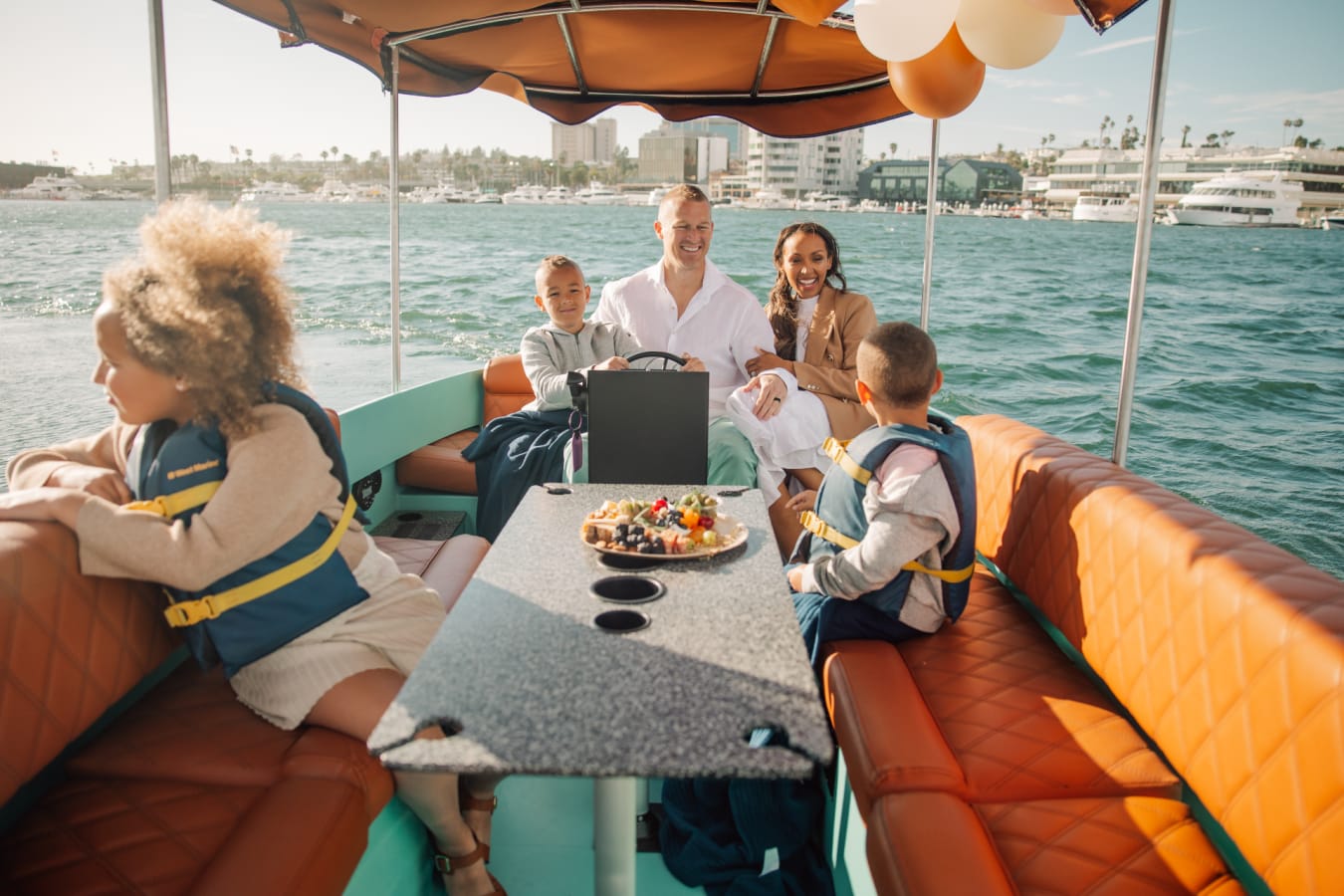 Family on a boat in Newport Beach 