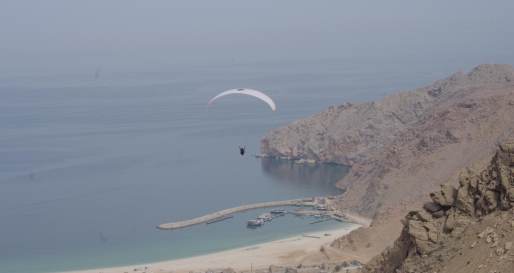 Paragliding into Zighy Bay