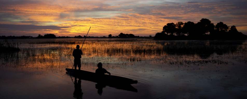 Sunset from a mokoro - Tubu Tree Camp
