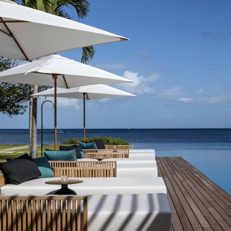 Beachfront Villa chaise longues on the deck