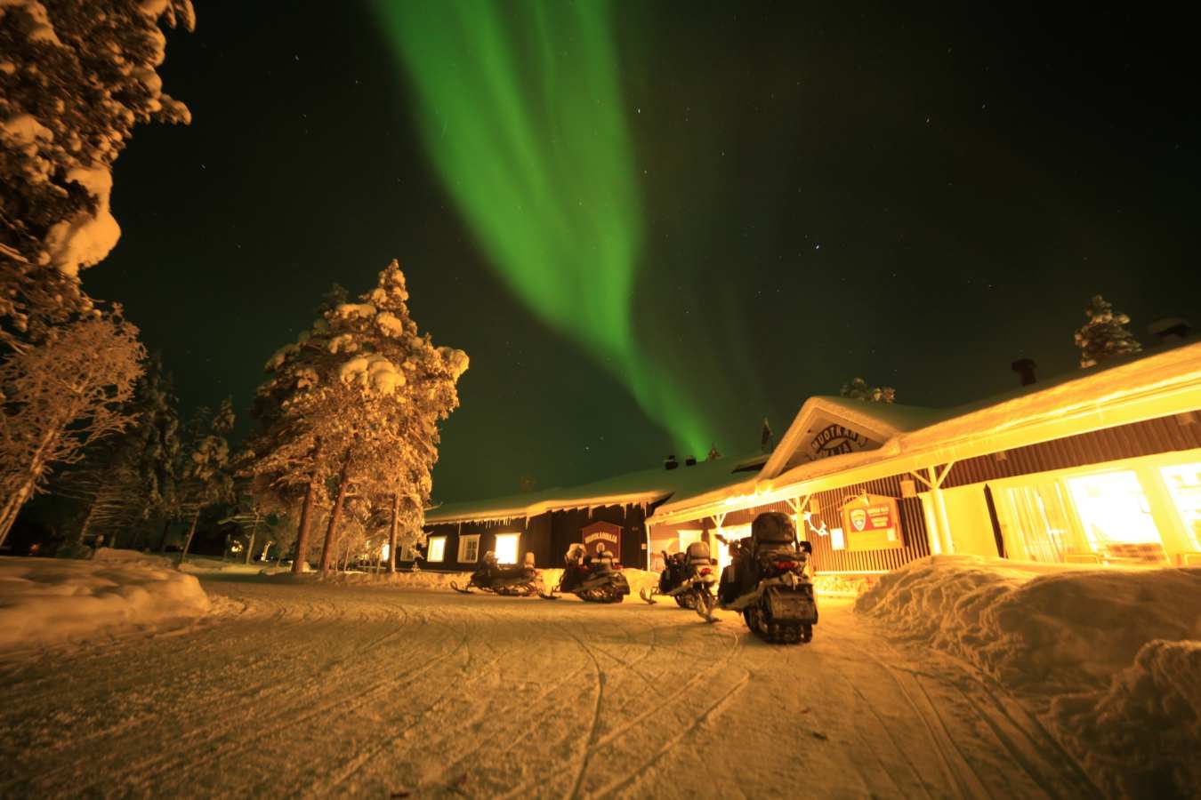 Snowmobiles outside main building 