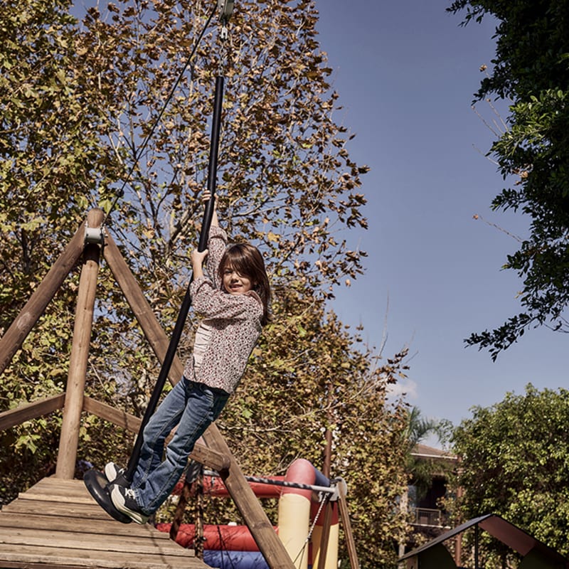  Child on zip-line in playground 